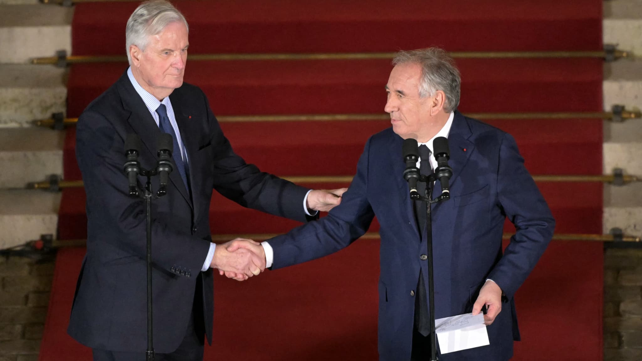 Michel Barnier and François Bayrou, the new Prime Minister, during the transfer of power at Matignon, on December 12, 2024.
