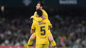 Lionel Messi et Sergio Busquets avec le Barça.