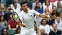 Le Serbe Novak Djokovic, lors de son match du 1er tour contre le Britannique Jack Draper, le 28 juin 2021 au tournoi de Wimbledon à Londres