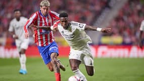 Vinicius Jr face à Rodrigo de Paul lors du match Atlético-Real Madrid le 29 septembre 2024