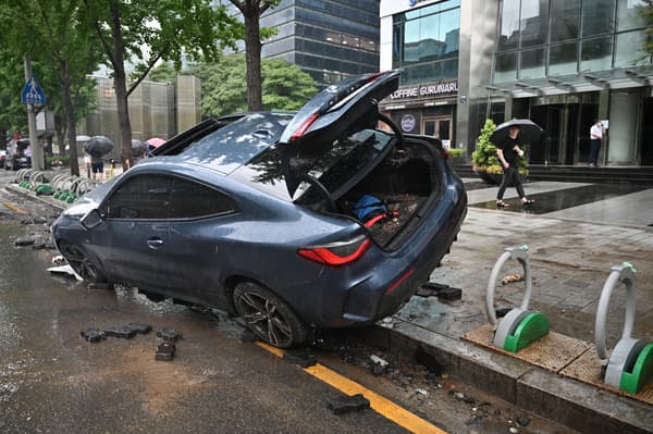 A car damaged by a flood in the Gangnam district of Seoul on August 9. A car damaged by a flood in the Gangnam district of Seoul on August 9.
