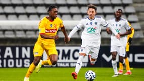 Isaac TSHIMPAMBA of Quevilly Rouen Metropole and Maxime LOPEZ of Paris FC during the French Cup match between Paris and Quevilly.