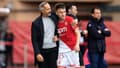 Le coach de Monaco Adi Hutter avec son joueur Aleksandr Golovin, 17 mars 2024