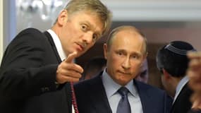 Le porte-parole Dmitry Peskov avec Vladimir Poutine, en 2013.