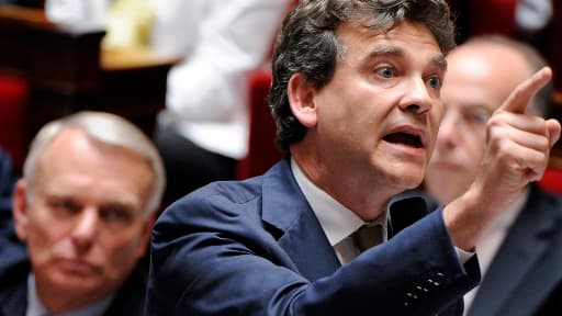 Arnaud Montebour et en arrière plan Jean-Marc Ayrault, le 17 juillet 2012 à l'Assemblée nationale.