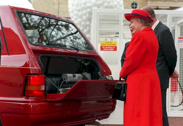 Britain's Queen Elizabeth II and her husband the Duke of Edinburgh (R partly hidden) view a specially-converted Metrocab in London 07 May 1998 during the launch of the new environmentally friendly Liquid-Propane Gas-powered Royal Car Fleet.