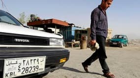 En Afghanistan, le secteur automobile, en pleine expansion, est frappé de plein fouet par "la malédiction du 39", un chiffre devenu du jour au lendemain synonyme de souteneur et de honte dans ce pays musulman très conservateur. /Photo prise le 14 juin 201