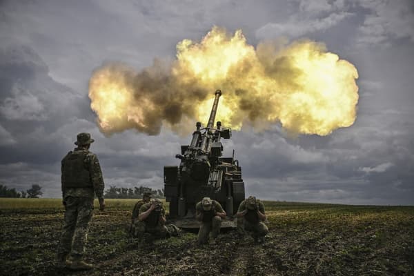 Ukrainian soldiers fire a Caesar cannon at Russian positions on the front line in the Donbass region, June 15, 2022.