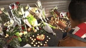 Attentats de Paris: scènes de recueillement devant le Petit-Cambodge à Paris