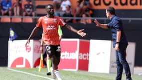 Terem Moffi et Régis Le Bris avec Lorient.