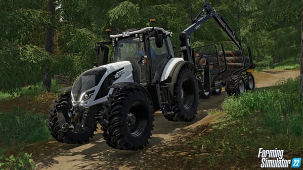 Un tracteur équipé d'une remorque à bois. Un tracteur équipé d'une remorque à bois.