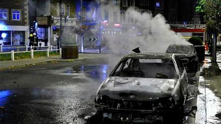 Dans une rue du quartier d'Ealing, à Londres. Paris appelle ses ressortissants à faire preuve d'une "extrême prudence" lors des sorties nocturnes en Grande-Bretagne, où les émeutes se sont étendues à d'autres villes d'Angleterre. "Des actes de délinquance