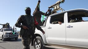 Des membres des brigades Ezz-Al Din Al-Qassam, la branche armée du mouvement Hamas, participent à un défilé militaire dans une rue de Khan Yunis, dans le sud de la bande de Gaza, le 27 mai 2021.
