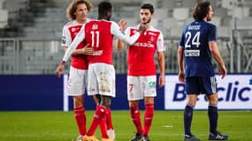 Boulaye Dia et Xavier Chavalerin de Reims, le Bordelais Paul Baysse en arrière plan. 