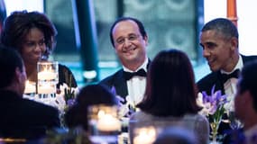 François Hollande entouré de Barack et Michelle Obama, lors du dîner à la Maison Blanche.