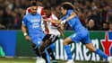 Dimitri Payet et Matteo Guendouzi entourent Tyrell Malacia