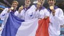 Clément Lefert à gauche lors du sacre olympique du relais 4x100m