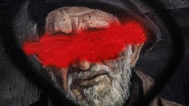 Cette photographie montre un détail de la célèbre fresque lyonnaise de CiteCreation représentant l'abbé Pierre avec son visage barré de rouge, à Lyon dans le centre-est de la France, le 30 septembre 2024.