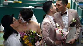 The first couples to marry embraced and kissed after receiving their marriage certificates