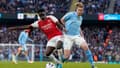 Bukayo Saka et Kevin De Bruyne lors de Manchester City-Arsenal, le 31 mars 2024