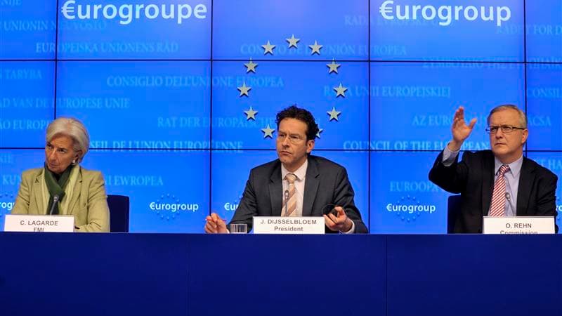 La directrice générale du FMI Christine Lagarde, le président de l'Eurogroupe Jeroen Dijsselbloem et le commissaire européen aux Affaires économiques et monétaires Olli Rehn, samedi à Bruxelles. Au terme d'une réunion de plus de dix heures, les ministres