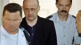 Jean-Claude Romand à son procès pour les meurtres de sa femmes, de ses enfants et de ses parents.