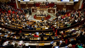 Le ministre de l'Intérieur Gérald Darmanin à l'Assemblée nationale à Paris le 11 décembre 2023, jour où une motion a rejeté son projet de loi immigration
