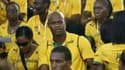 Les athlètes jamaïcains autour d'Asafa Powell, lors de la cérémonie d'ouverture des Jeux.