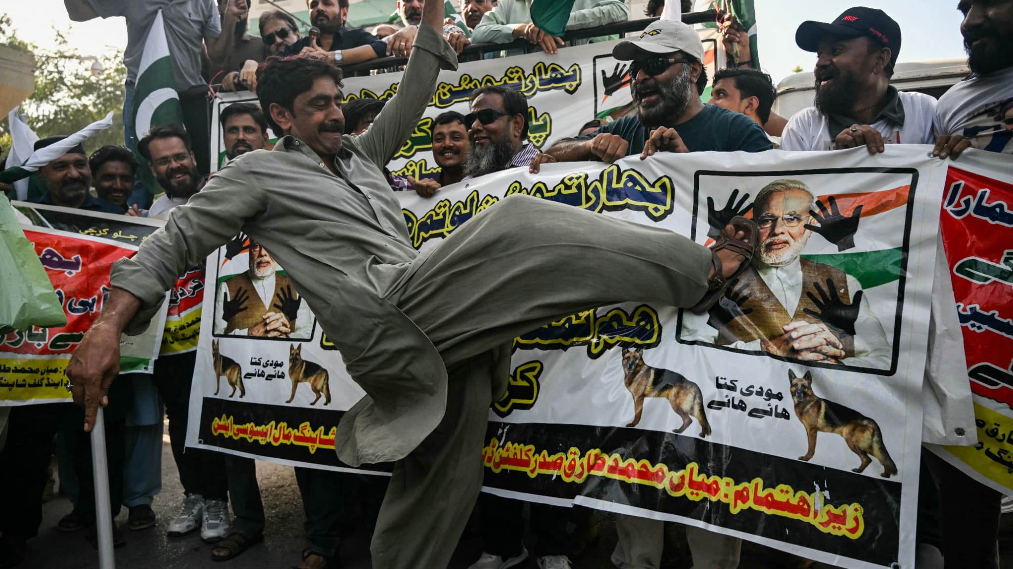 A merchant kicked the photo of Indian Prime Minister Narendra Modi during a demonstration against India in Karachi, on April 29, 2025.