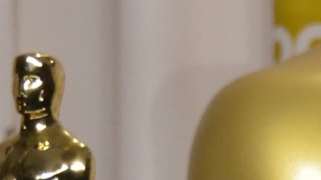Jean Dujardin avec son Oscar, en 2012 et Marion Cotillard en 2014