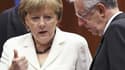 La chancelière allemande Angela Merkel en compagnie du président du Conseil italien Mario Monti vendredi à Bruxelles. Les médias européens, y compris allemands, estiment qu'Angela Merkel sort perdante du Conseil européen de jeudi et vendredi à Bruxelles.