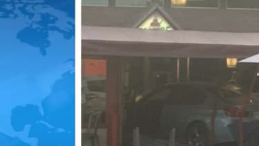 La voiture encastrée dans la pizzeria.