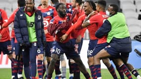 La joie des joueurs de Lille après leur victoire sur Lyon lors du match de Ligue 1 à Décines-Charpieu, le 25 avril 2021
