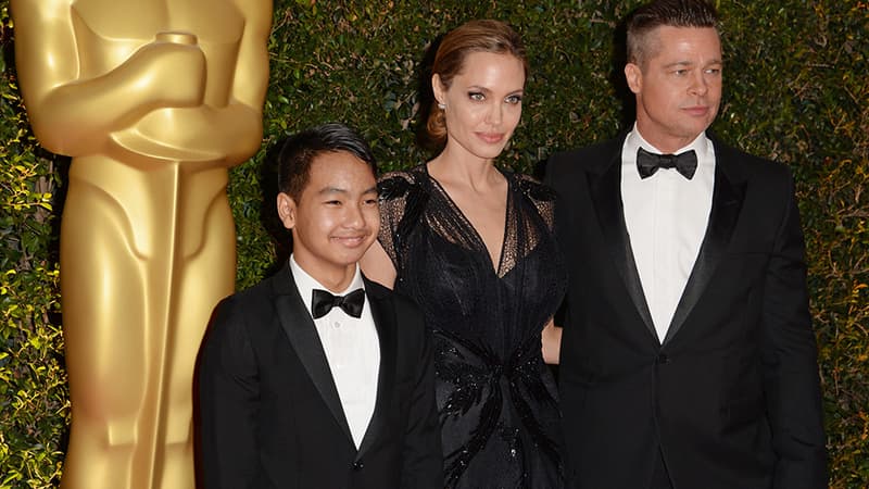 Maddox Jolie-Pitt et ses parents, Angelina Jolie et Brad Pitt en 2013.
