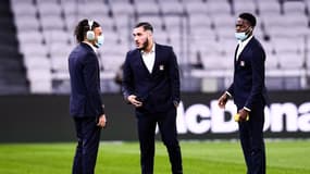 Les Lyonnais Malo Gusto avec Rayan Cherki et Castello Lukeba au Groupama Stadium, le 21 janvier 2022