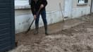 Un habitant de Tremblay-en-France (Seine-Saint-Denis) en train déblayer sa cour après d'importantes chutes de grêle dans la nuit de mercredi 1er à jeudi 2 mai 2024.