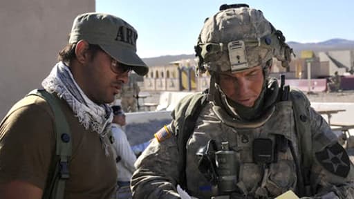 Le sergent Robert Bales, à droite sur la photo, en 2011 en Afghanistan. Mercredi, il a plaidé coupable d'assassinat de 16 villageois afghans.