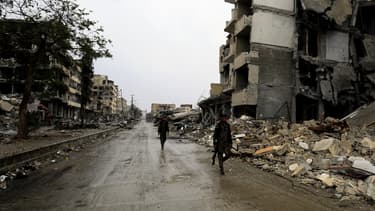 Des membres des Forces démocratiques syriennes à Raqqa, le 28 octobre, après que la ville a été reprise aux mains des jihadistes.
