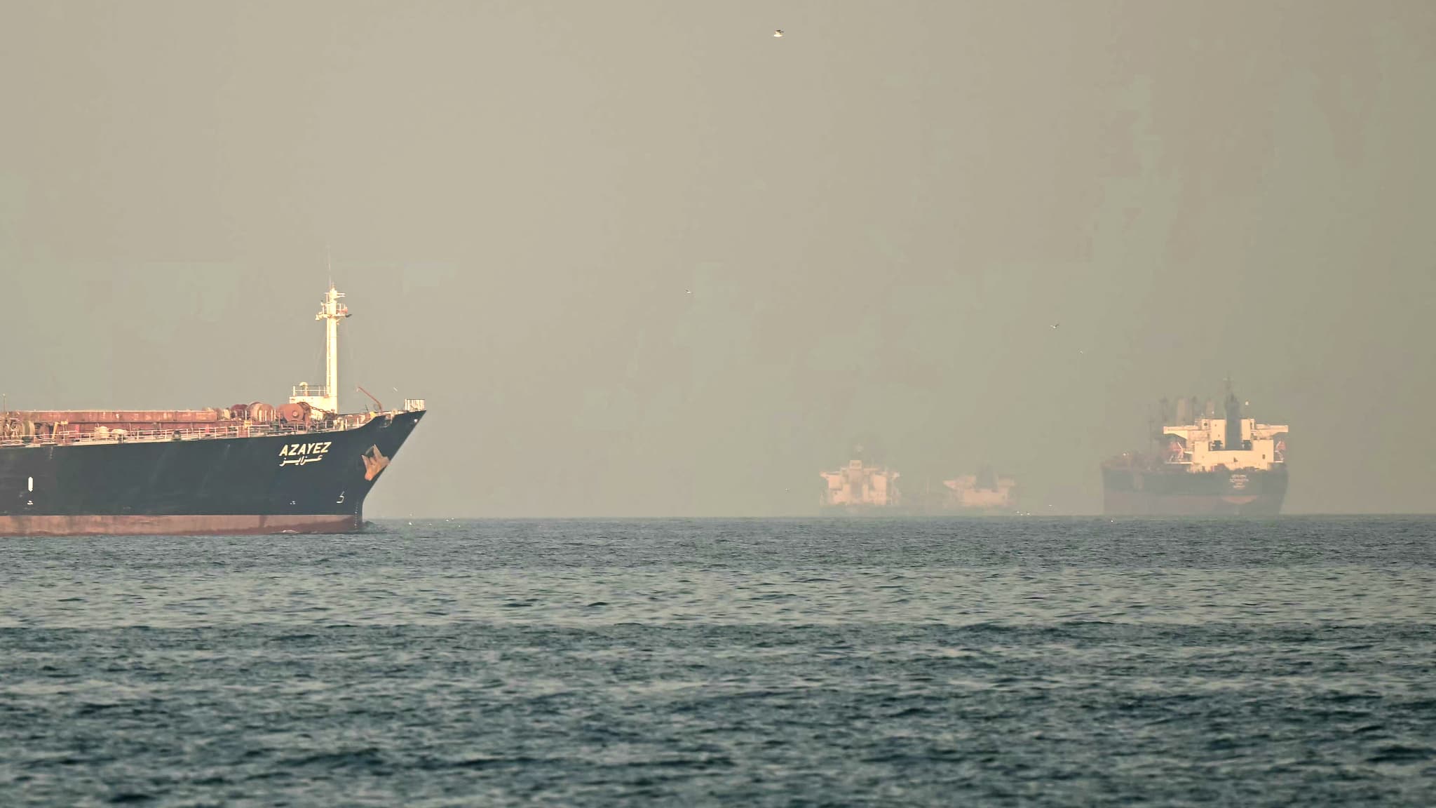 After the ceasefire agreement between the United States and Iran, two ships cross the strait…