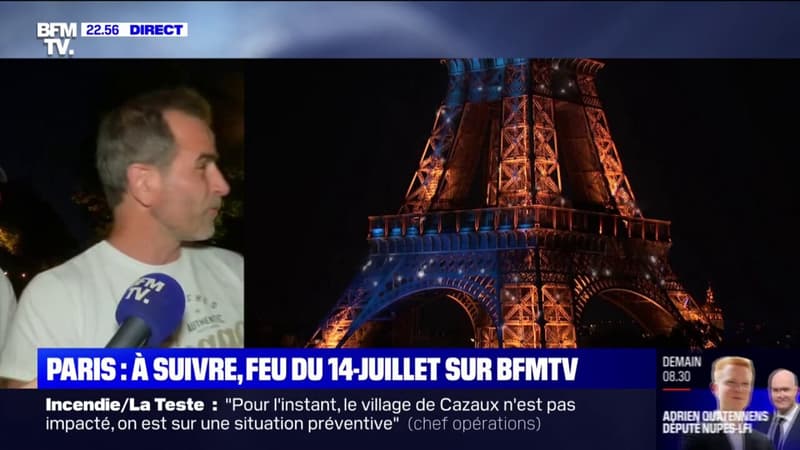 Les parisiens prêts à admirer le feu d'artifice tiré depuis la tour Eiffel