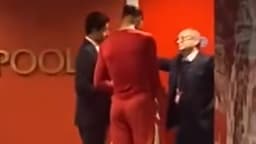 Nasser al-Khelaïfi, Virgil van Dijk et Luis Campos après Liverpool-PSG, le 11 mars 2025 à Anfield en Ligue des champions