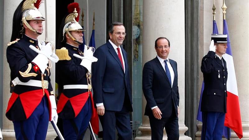 François Hollande et le Premier ministre grec Antonis Samaras, à l'Elysée. Des décisions rapides devront être prises sur la Grèce après le rapport de la troïka, a déclaré samedi François Hollande après une rencontre avec Antonis Samaras à Paris. /Photo pr