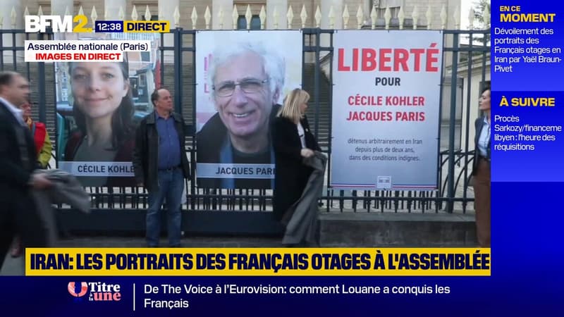 Otages en Iran: les portraits de Cécile Kohler et Jacques Paris sur les grilles de l'Assemblée nationale