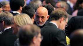 Le président afghan Hamid Karzaï, à Chicago. Les membres de l'Otan ont convenu de transférer aux forces afghanes la responsabilité des opérations de combat à la mi-2013. Le communiqué final du sommet de Chicago précise que l'Alliance ne fera plus que form