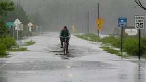 Rue inondée à Panacea en Floride. La tempête tropicale Debby a déversé lundi des pluies diluviennes sur certaines parties de la Floride, où l'on craint des inondations et de nouvelles tornades. Le gouverneur de l'Etat, Rick Scott, a décrété l'état d'urgen