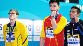 Mack Horton (à gauche) et Sun Yang (au centre) lors des Mondiaux 2019