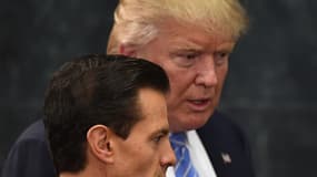 US presidential candidate Donald Trump (R) and Mexican President Enrique Pena Nieto prepare to deliver a joint press conference in Mexico City on August 31, 2016. Donald Trump was expected in Mexico Wednesday to meet its president, in a move aimed at showing that despite the Republican White House hopeful's hardline opposition to illegal immigration he is no close-minded xenophobe. Trump stunned the political establishment when he announced late Tuesday that he was making the surprise trip south of the border to meet with President Enrique Pena Nieto, a sharp Trump critic.

YURI CORTEZ / AFP