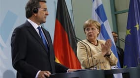 Antonis Samaras, le Premier ministre grec et Angela Merkel. La chancelière allemande a déclaré vendredi qu'elle et François Hollande étaient convaincus qu'aucune décision sur l'aide à la Grèce ne devait être prise avant que la "troïka" des créanciers inte