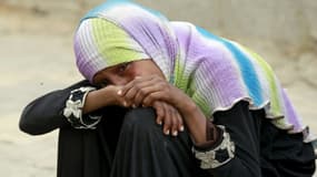 Désolation d'une Yéménite après un raid meurtrier de l'aviation d'Arabie saoudite le 13 juillet 2015 à Sanaa