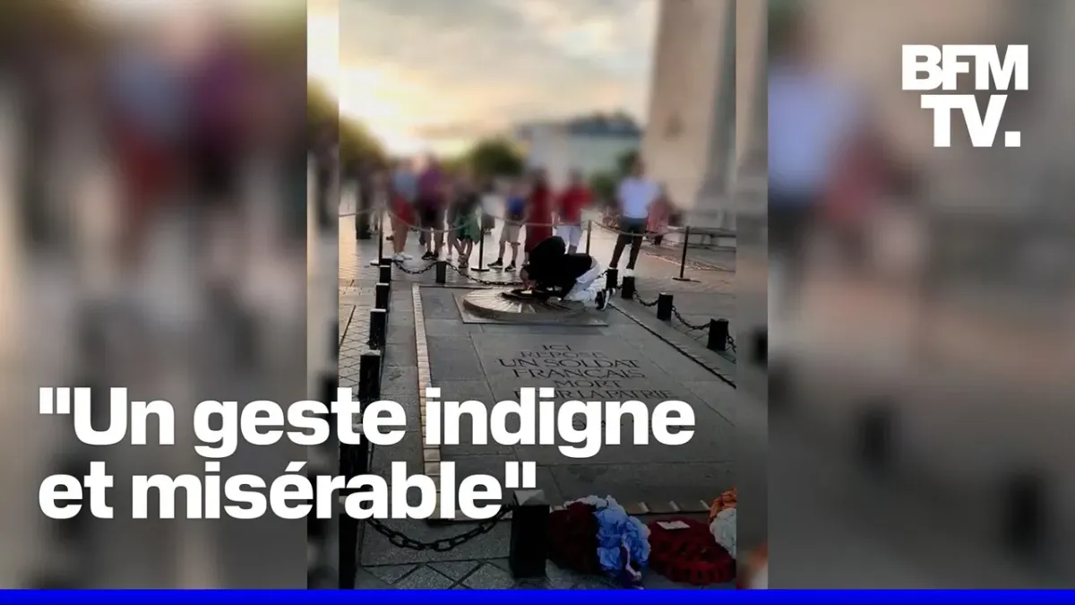Un homme allume sa cigarette avec la flamme de la tombe du Soldat inconnu